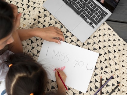 Primary students studying online on a laptop